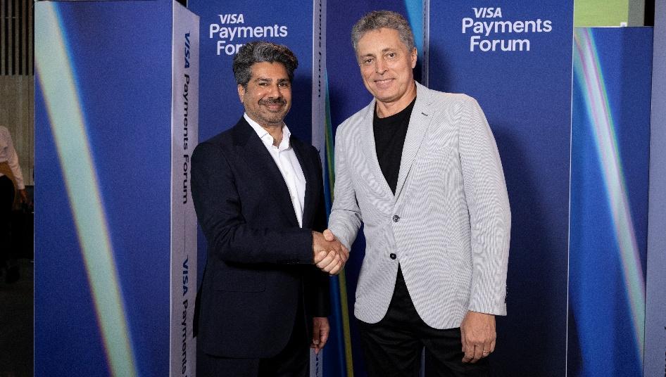 Nadeem Juma and Walter Lironi shaking hands at the Visa Payments Forum